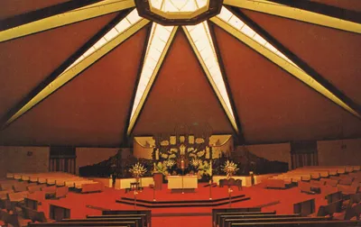 Interior photo of former (newer) church. Source: Scan of postcard