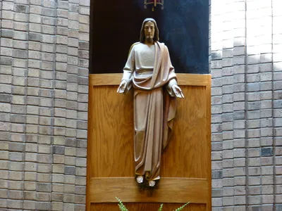 Statue of Christ behind altar.