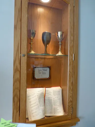 Chalices and bible in case.