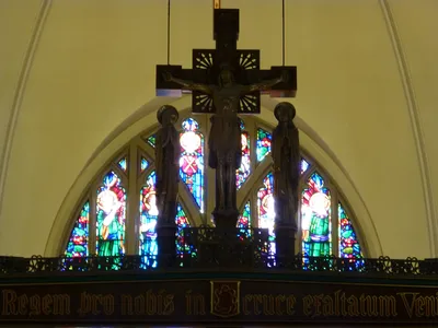 Crucifix atop beam.