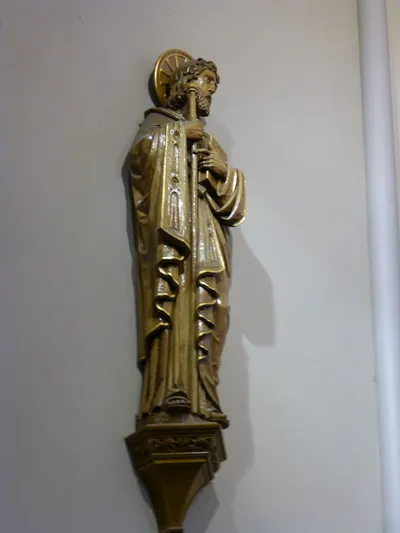 Statue on sanctuary wall.
