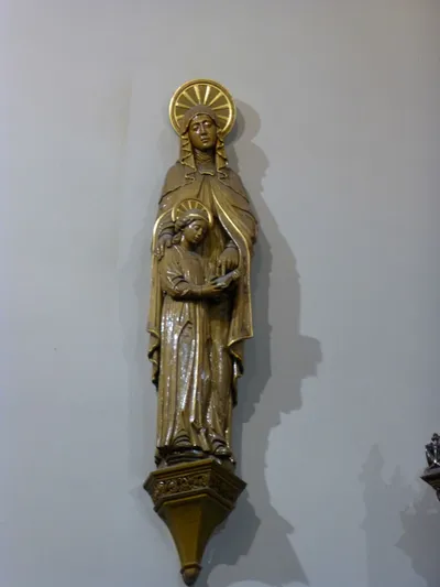 Statue on sanctuary wall.