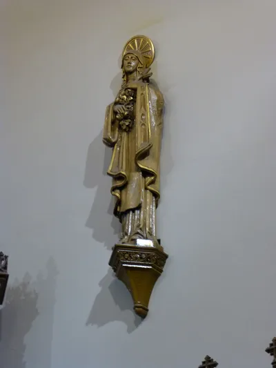 Statue on sanctuary wall.