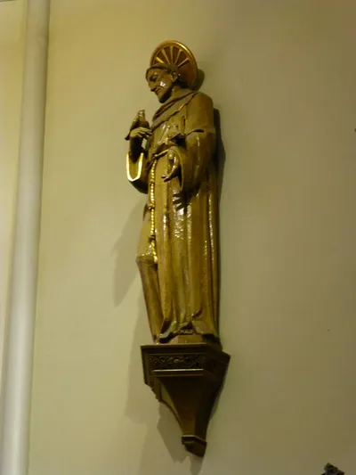 Statue on sanctuary wall.