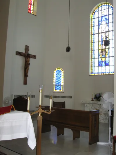 To the right of the sanctuary.