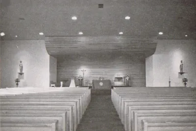 Redecorated church, 1979. This layout somewhat resembles the one used in Henrietta's Good Shepherd church. The interior has since been remodeled again so that the wood background extends the entire front of the church. The statues flanking the sanctuary have been moved to niches in the side walls.
