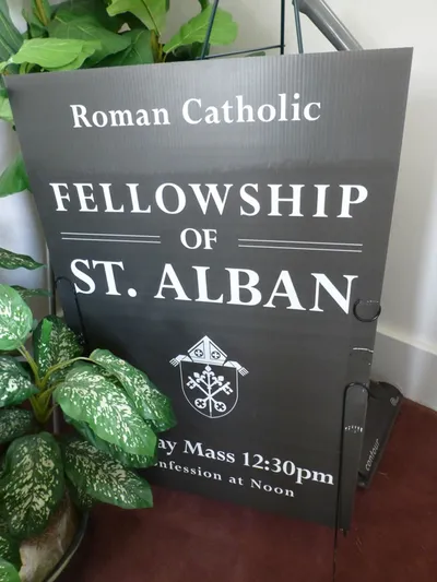 Sign for the Anglican Use group that worships in the church building.