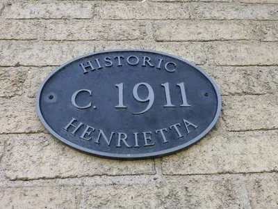 Historical site marker on front of the church.