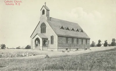 Postcard of the chapel from around 1910. The chapel is largely unchanged, save for the additional door on each side where the fourth stained glass windows were located.