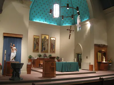 Sanctuary seen from an angle, lit up.