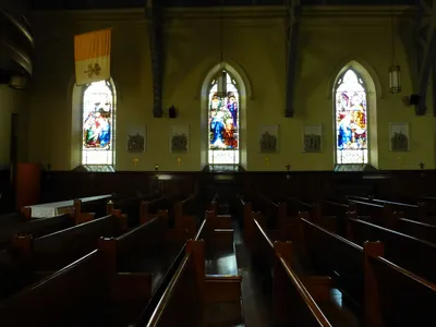 Left side of the church.
