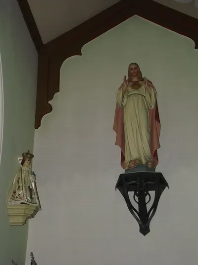 Infant of Prague and Sacred Heart statues.