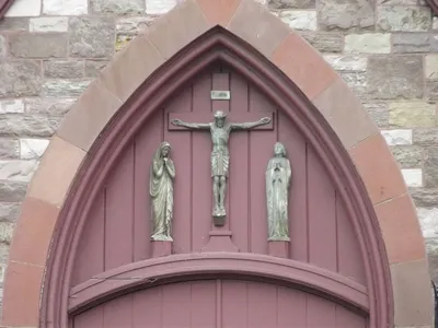 Crucifixion scene atop main entrance.