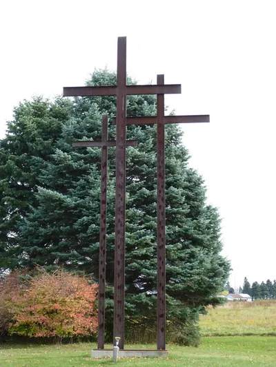 Crosses to the right of the church.