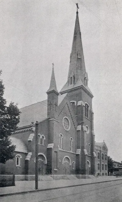 Exterior of church as it appeared between 1868-1928. Note tall steeple and lack of arches above the entrances. Source: Holy Family Centennial, 1864-1964