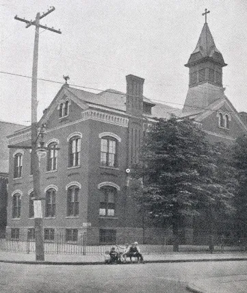 First school building. Source: Holy Family Centennial, 1864-1964