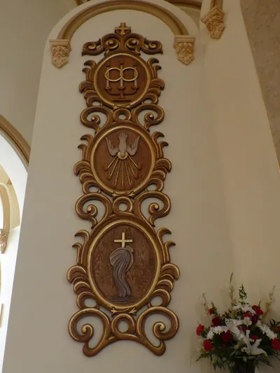 Sacramental reliefs to the left of the crucifix.