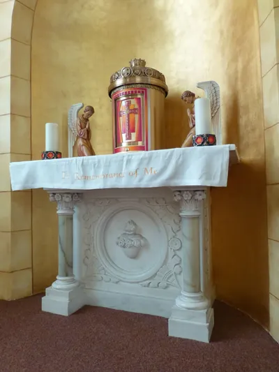 Close-up of tabernacle and side altar.