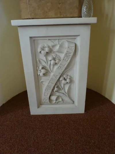 Pedestal below St. Joseph statue.