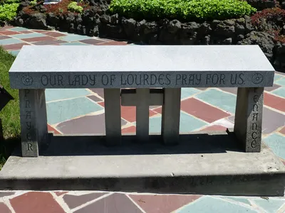 Kneeler before the grotto