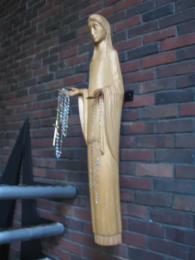Wall-mounted statue of Our Lady.