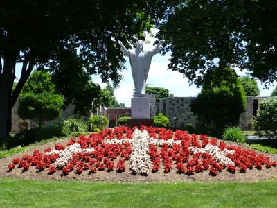 Statue of Christ at Dewey Ave entrance, seen from front.