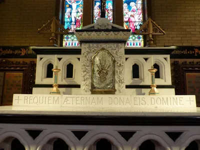 Top of the high altar and tabernacle. Latin inscription reads: "Grant them eternal rest, O Lord"