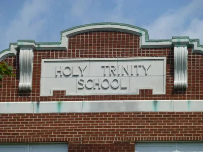 Inscription atop school building.