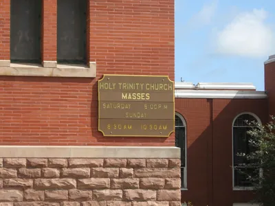 Mass times sign.