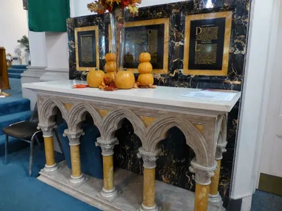 Altar with altar cards fused into the stone.