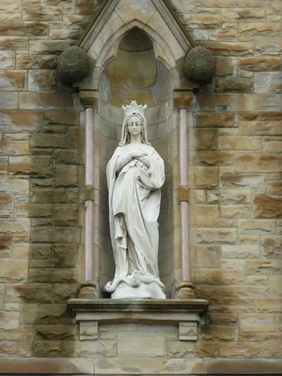 Statue of Our Lady in bell tower.