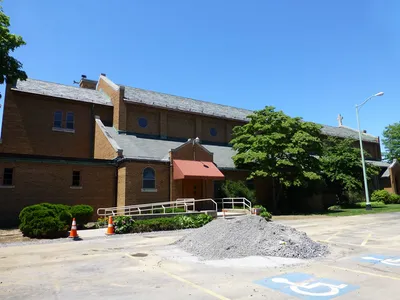 Left side of the church.