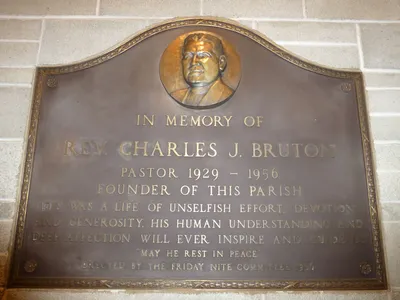 Memorial plaque honoring founding pastor.