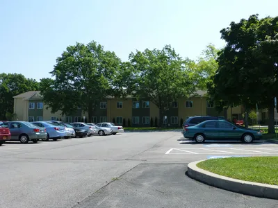 Addition of apartment residences to the left of the church.