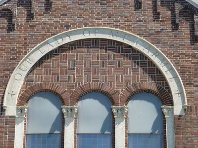 Inscription atop front of the church.