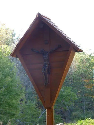 Crucifix alongside road leading to monastery.