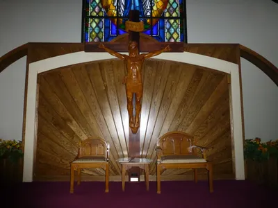 Celebrant's chair and crucifix.