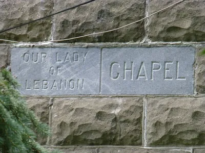 Former cement sign still on the chapel facade.