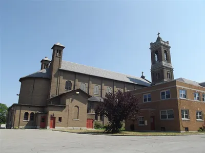 Church seen from parking lot on left side.