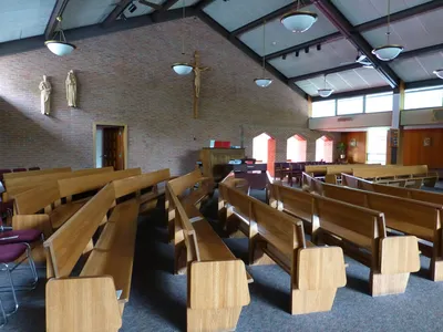 Left side of the church.