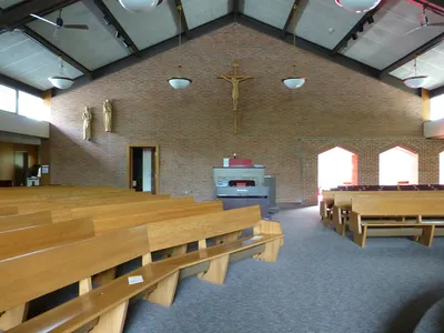 Left side of the church.