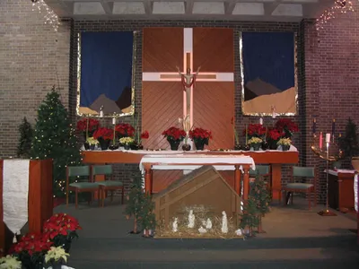 Sanctuary decorated for Christmas, 2004. Source: Formerly on the parish Web site