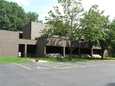 Left side of the church.