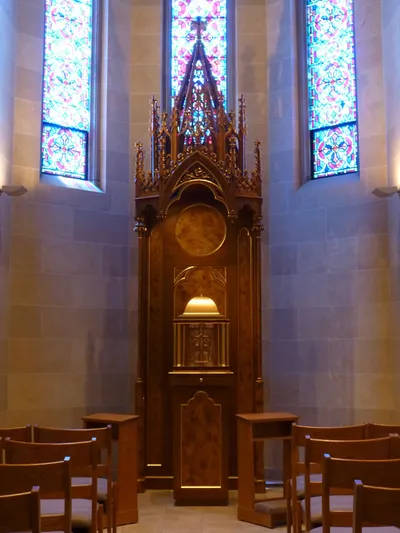 Tabernacle (from the former St. Philip Neri church where a priest and nun died in a fire attempting to rescue the blessed sacrament) with wood casing that was once part of the cathedra.