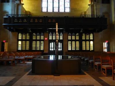 Baptismal font and paschal candle.