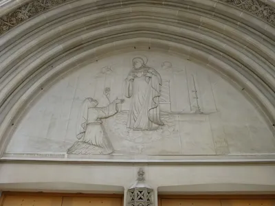 Relief above entrance.