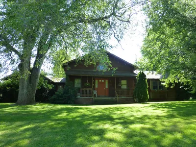 Exterior of modern-day home, seen with additions. Significant modifcations have taken place since 1989.