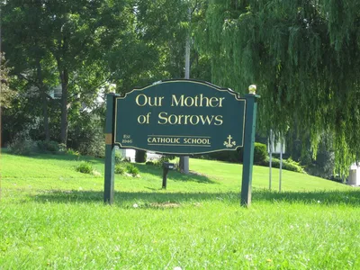 Sign for former school.