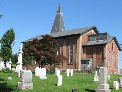 Right side of original church, and cemetery.
