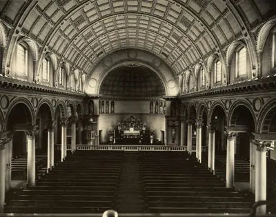 Photograph of church interior shortly after completion. Picture taken sometime between 1912-1929. Note the absence of the Last Supper painting above the altar as well as all the paintings of saints that would later be added inside of the many "circleds" along the church ceiling.